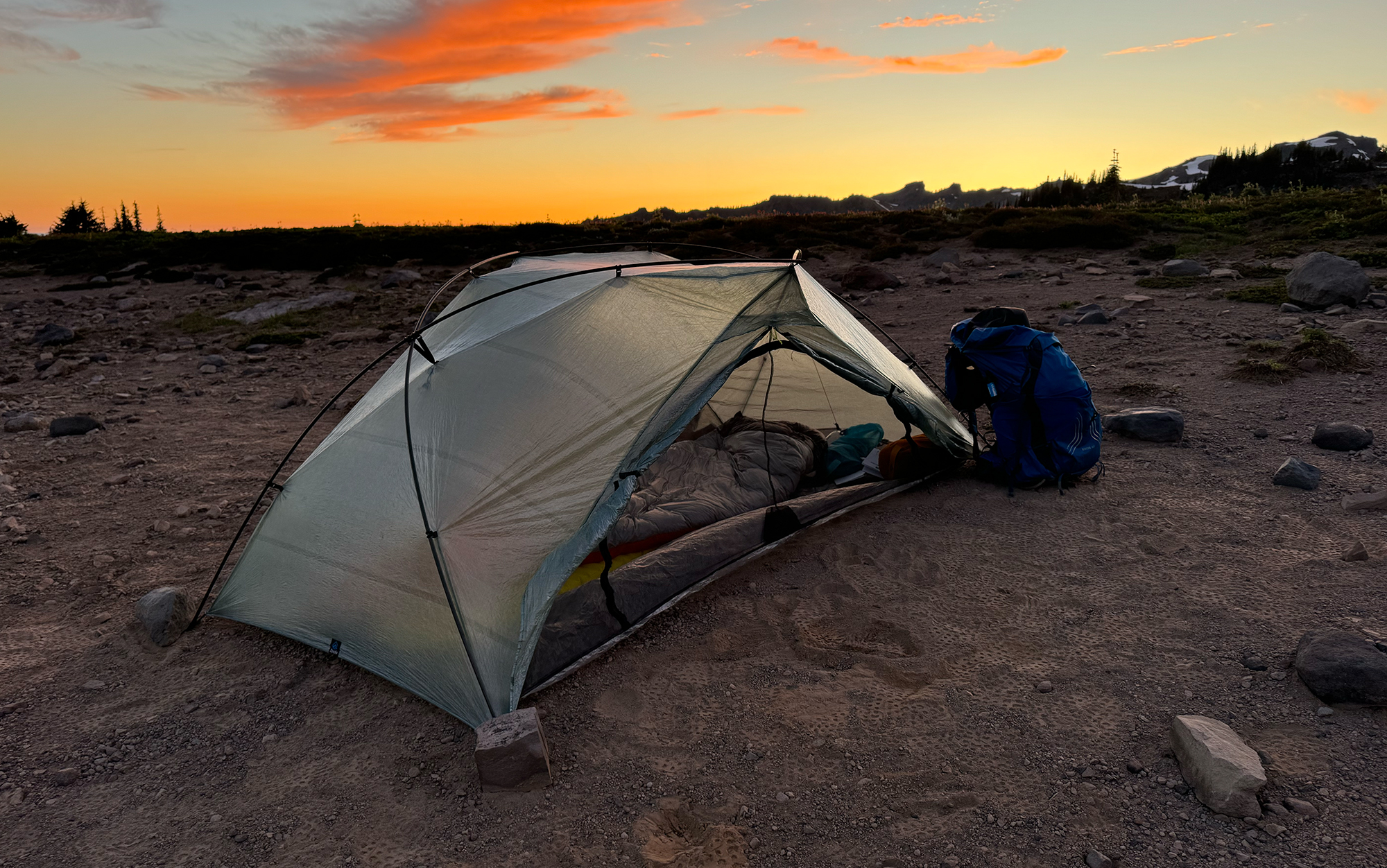 The Free Zip tent is set up on a ridge at sunset.