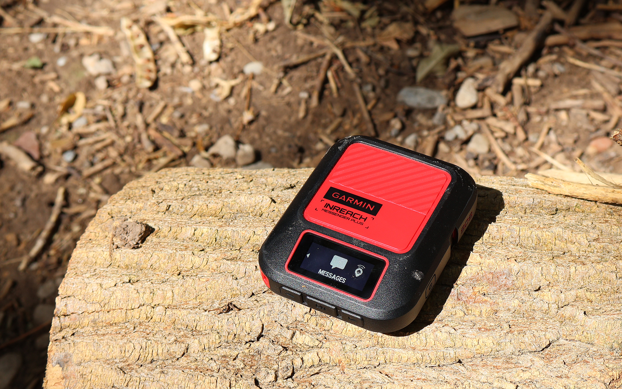  The new Garmin inReach Messenger Plus sits on a log.