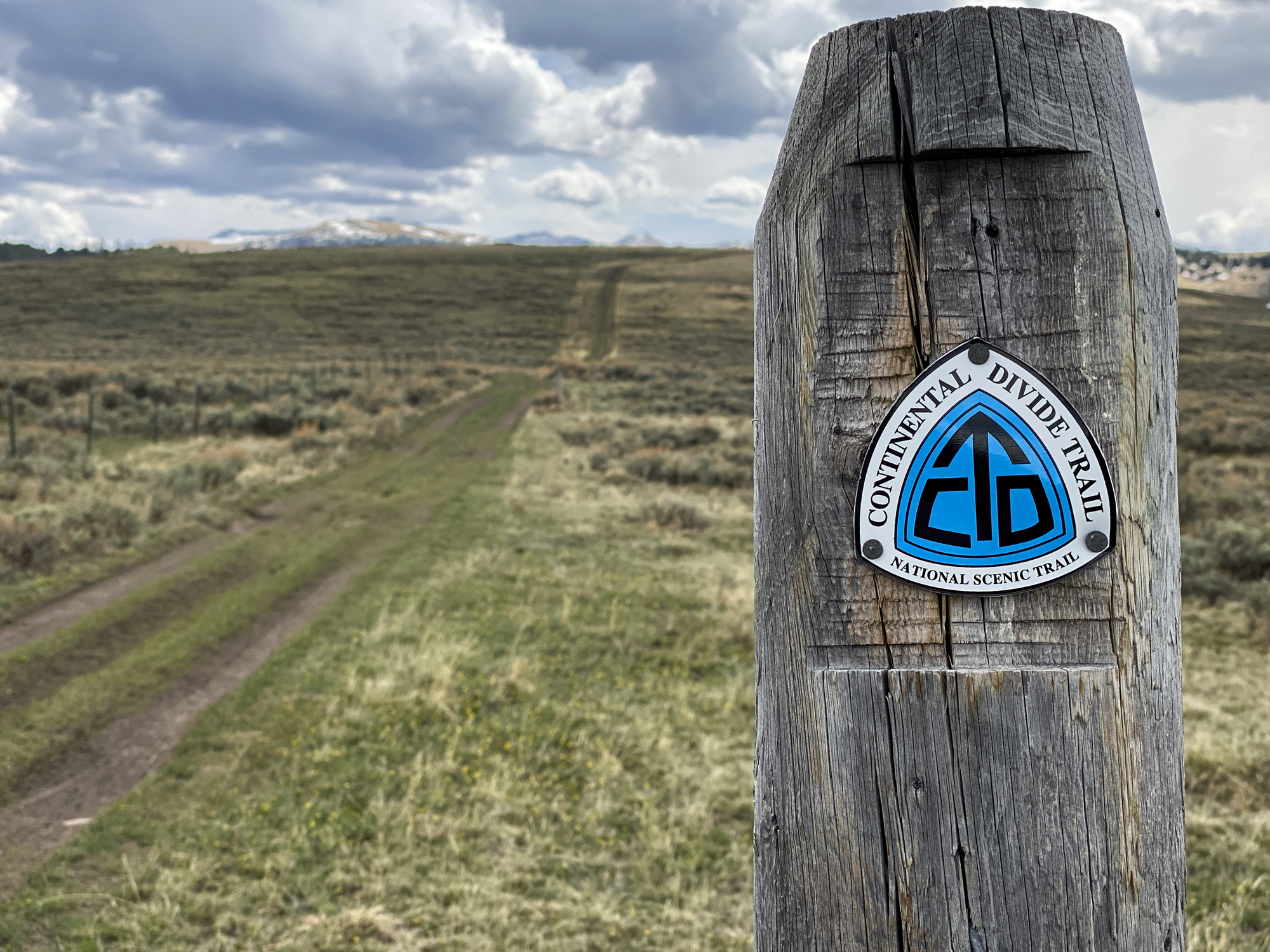 Dell, Montana - May 17, 2021: Trail marker for the Continental Divide Trail National Scenic Trail located at Bannack Pass on South Medicine Lodge Road near Dell, Montana.