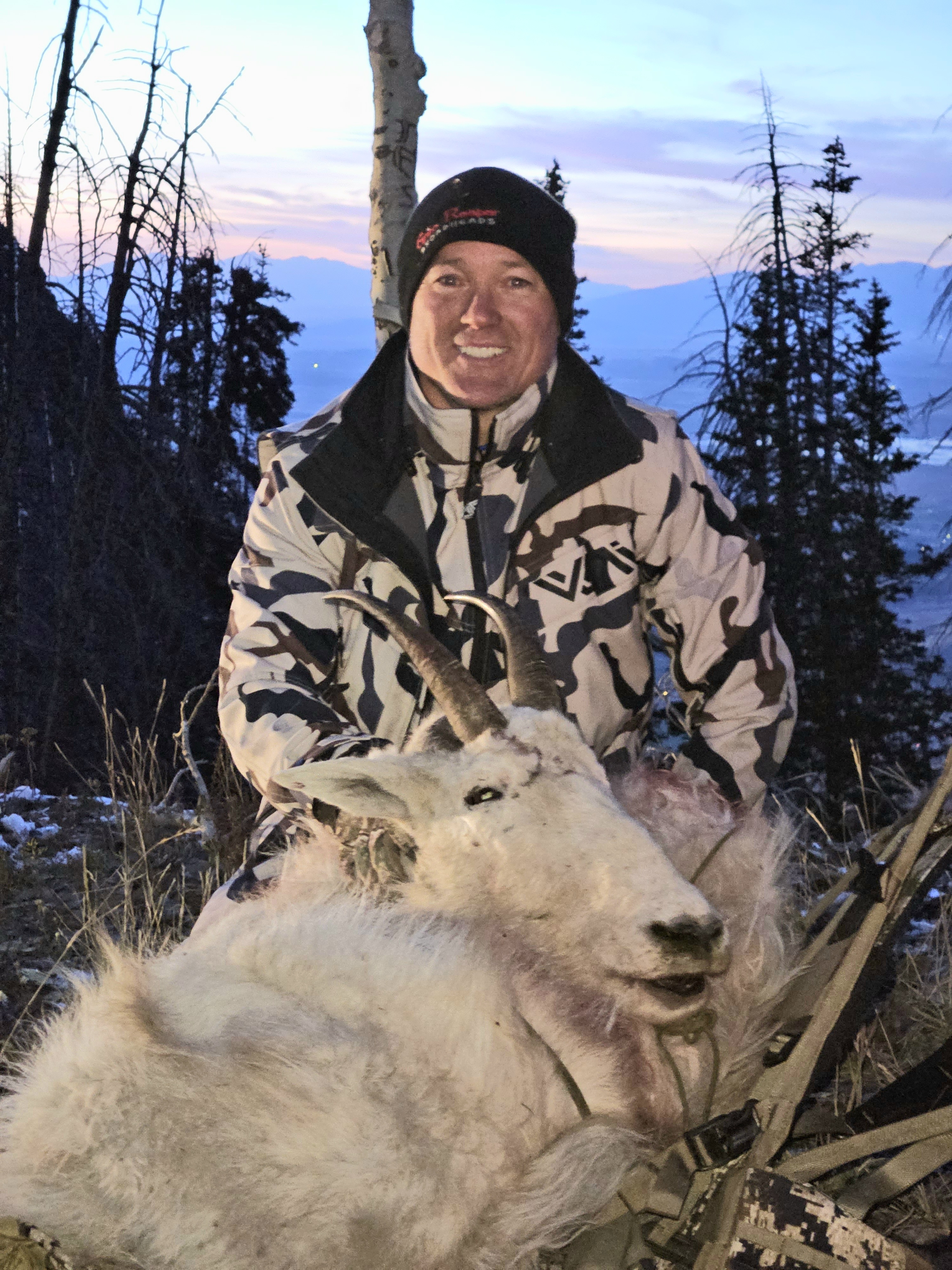 Justin Christensen poses with the hide and head of a mountain goat.