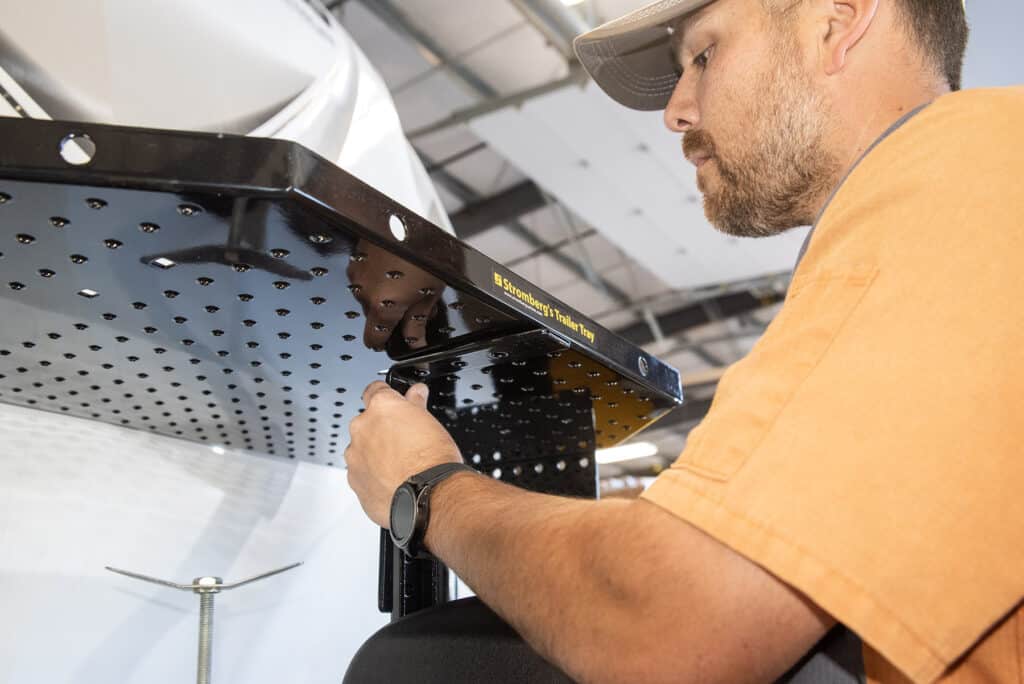 The trailer tray attaches to rear supports and a front L-braecket.