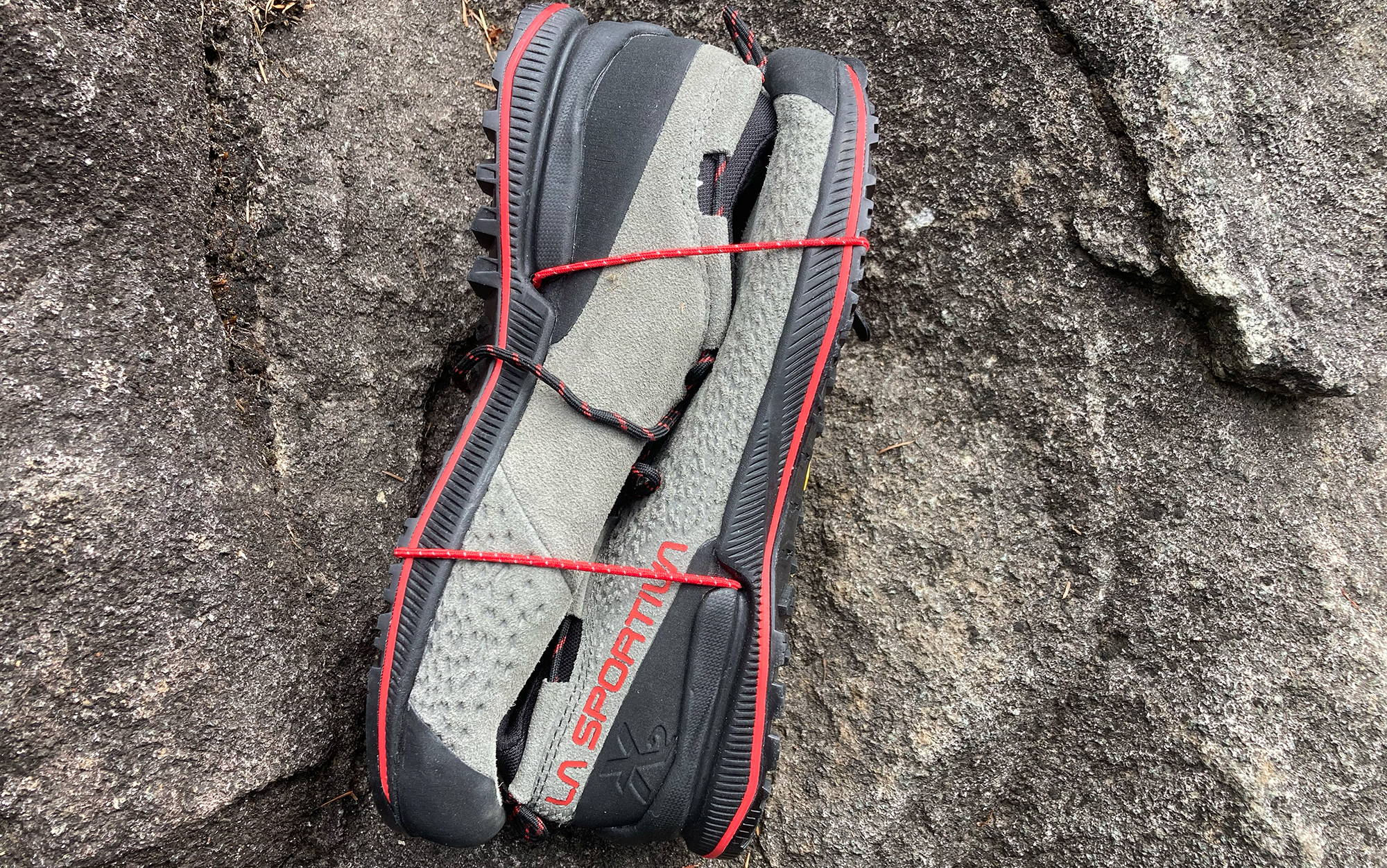 The LaSportiva TX2 approach shoes have elastic bands for easy packing.