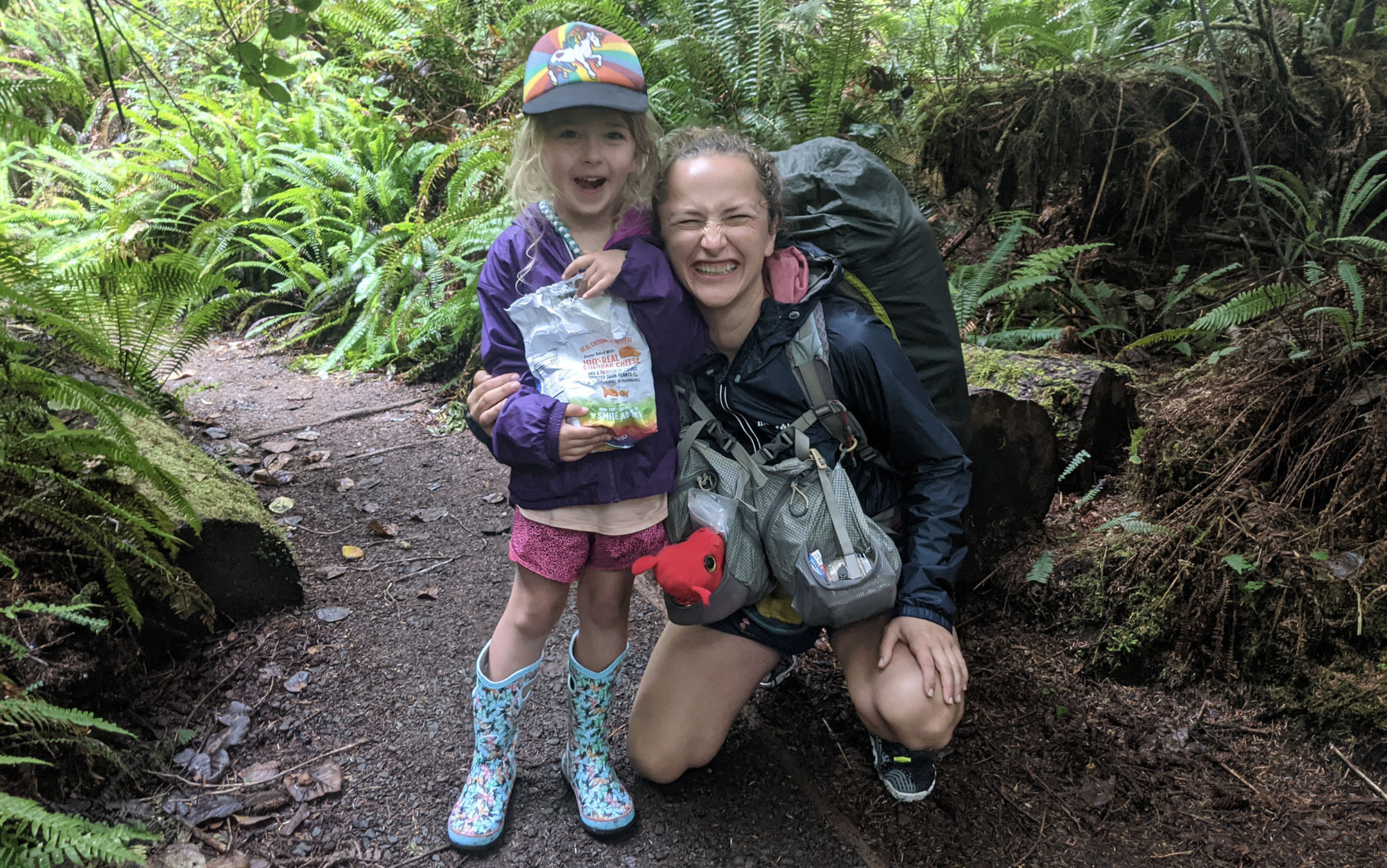 Woman and child on backpacking trail in the PNW