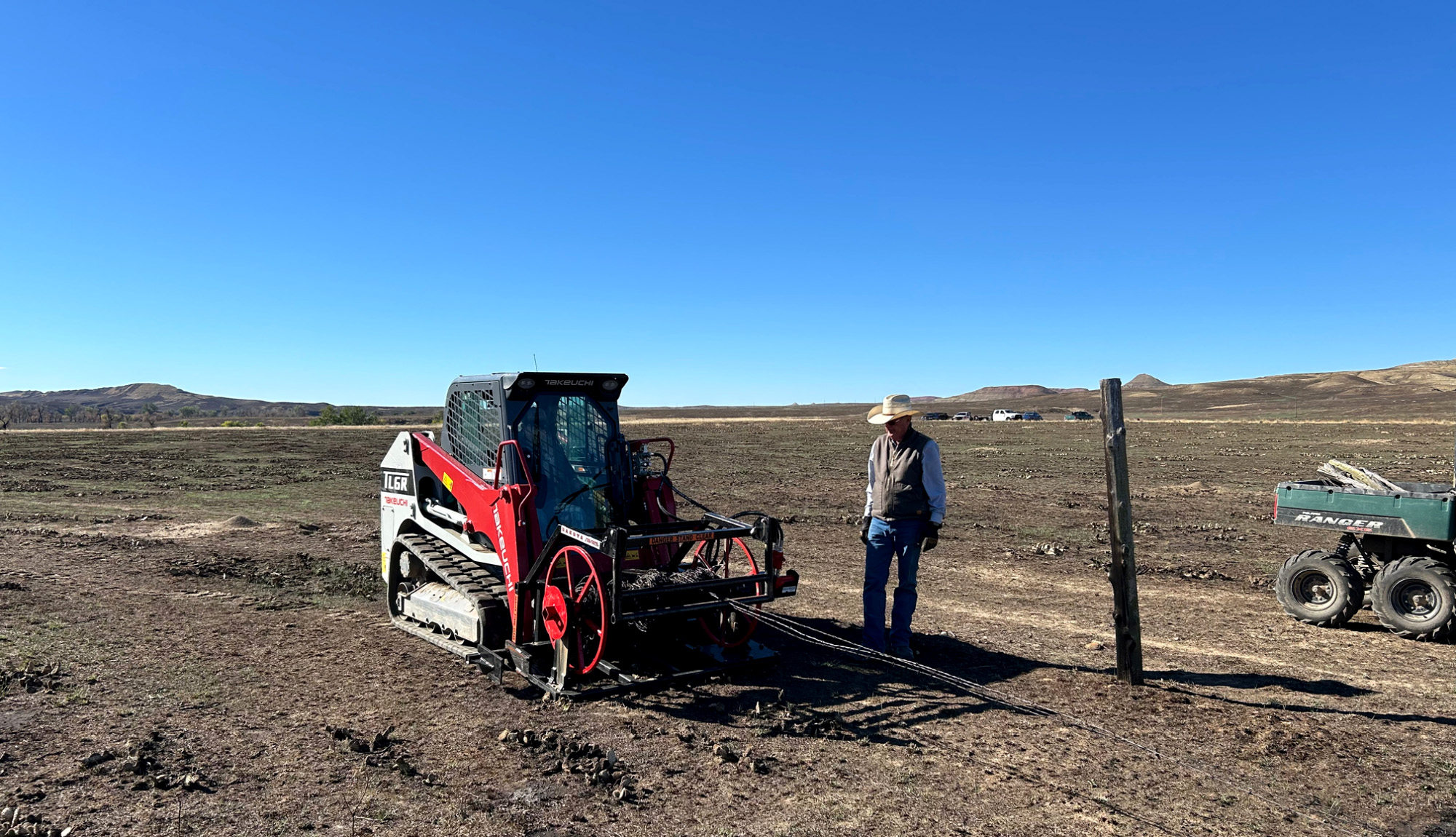 A rancher runs a wire winder in Wyoming.