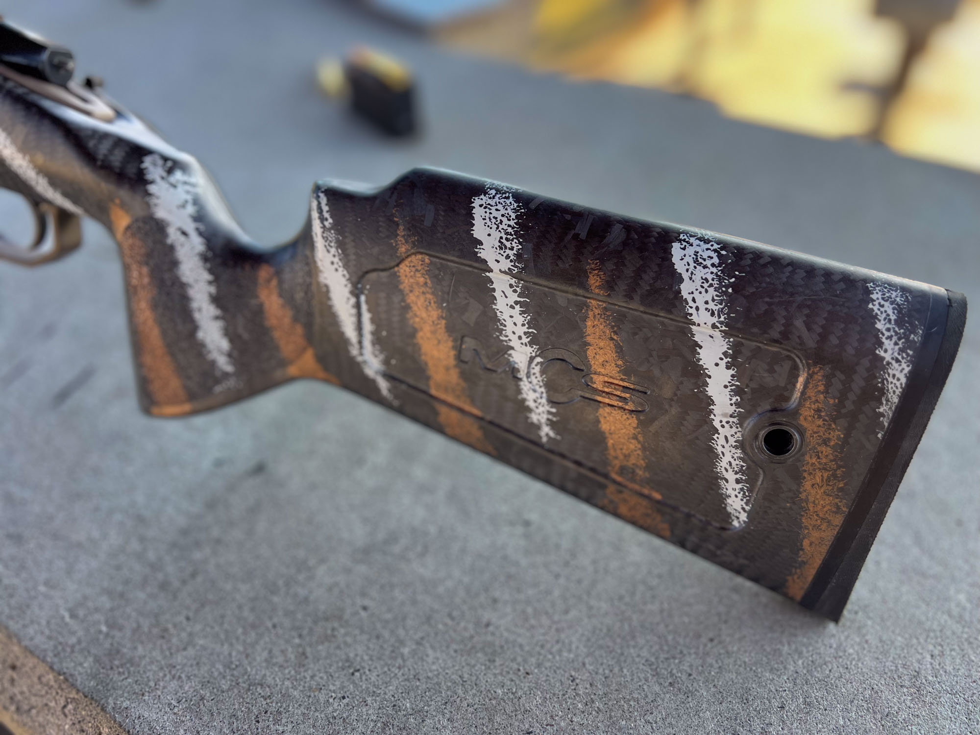 The striped stock of a Mack Brothers custom rifle.