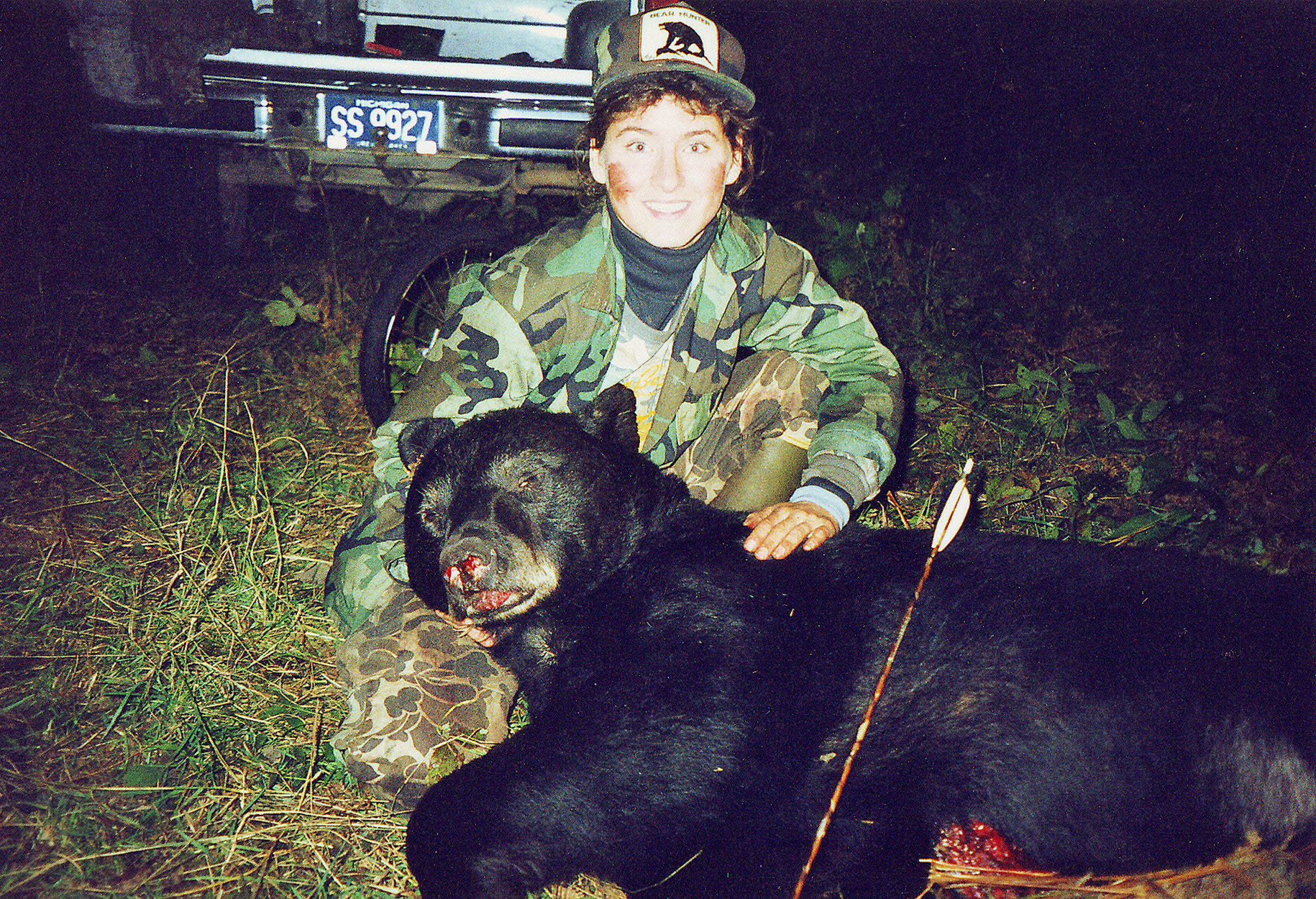 A Michigan hunter with a big black bear taken in 2009.