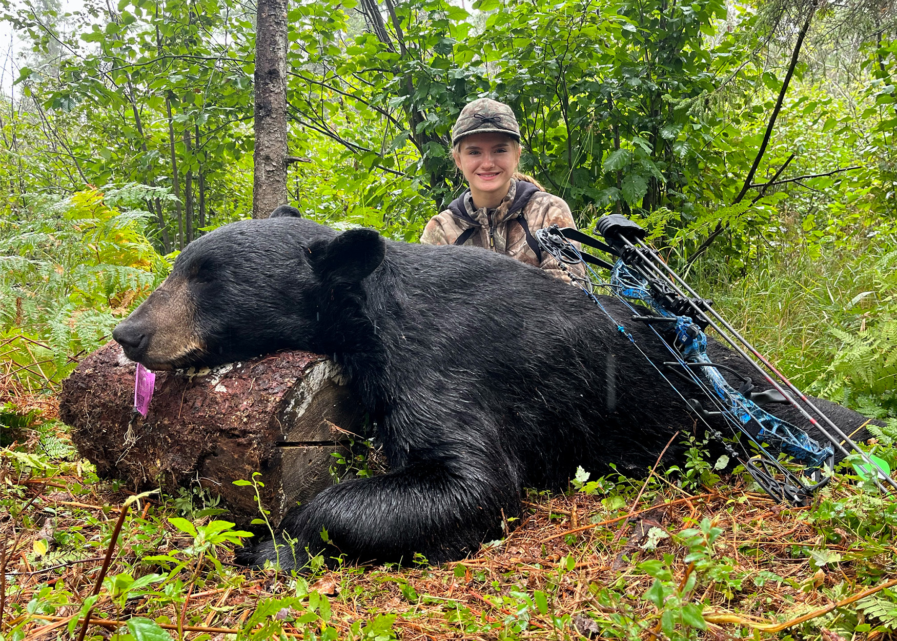 A Michigan hunter with a state-record black bear.