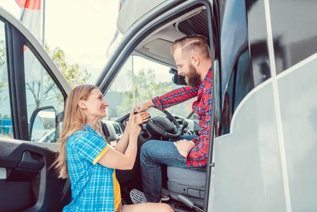 Couple picking out an RV at an RV dealer's lot