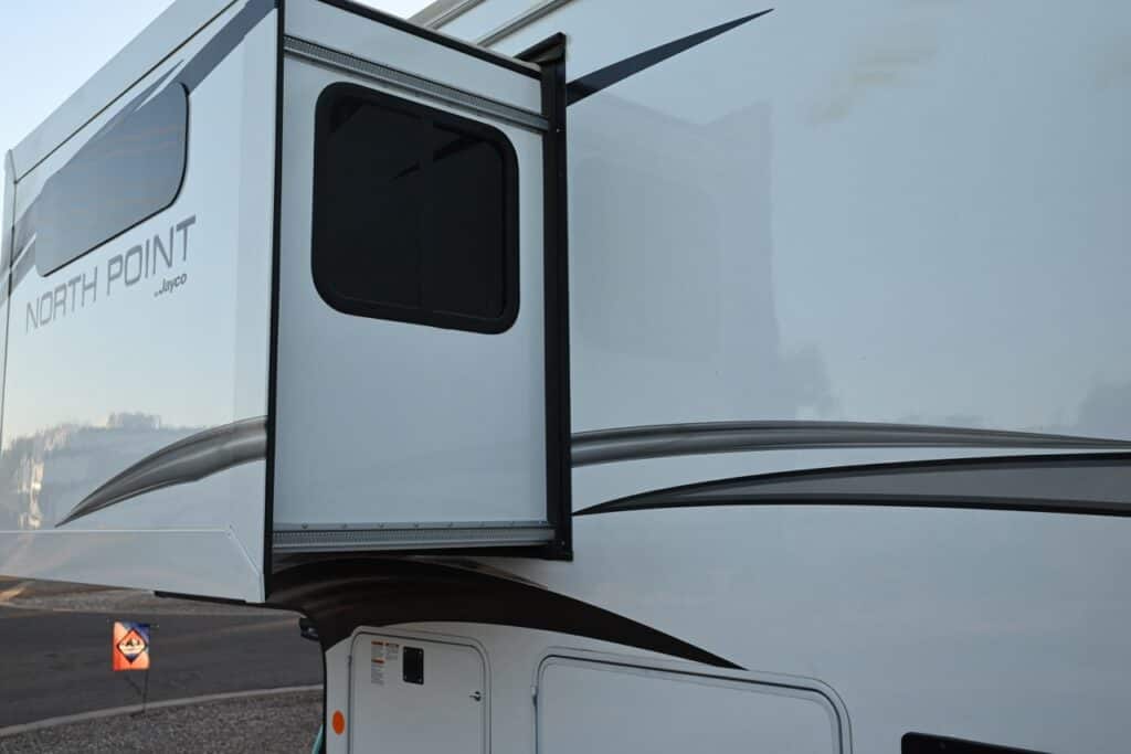 A slideout extended on a large fifth-wheel.