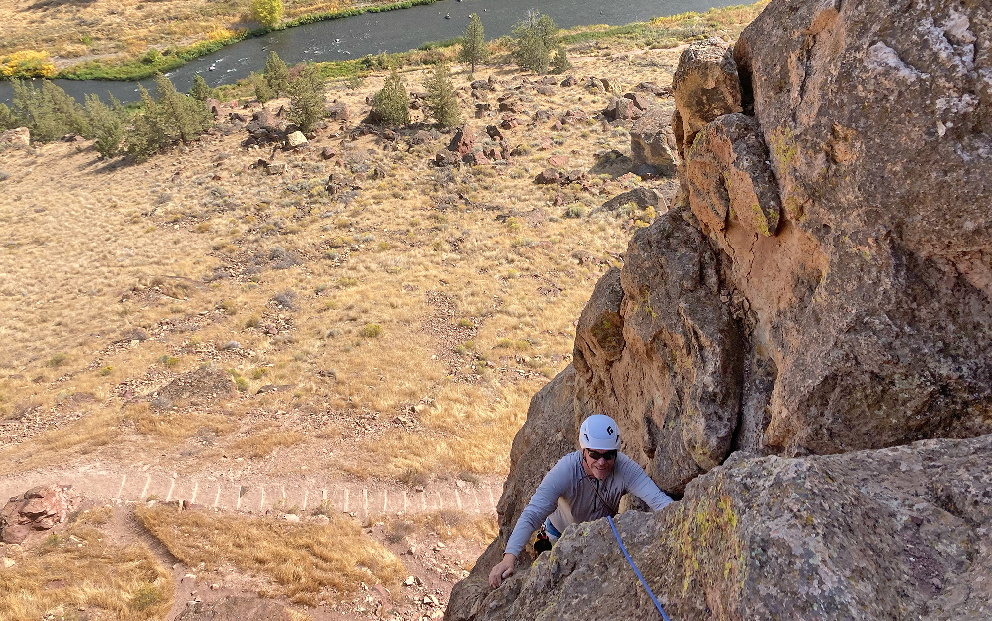 Climber ascends in Black Diamond Vapor climbing helmet.