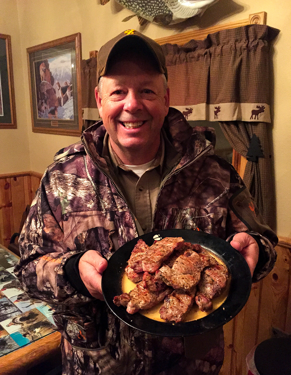 A hunter with mountain lion meat.