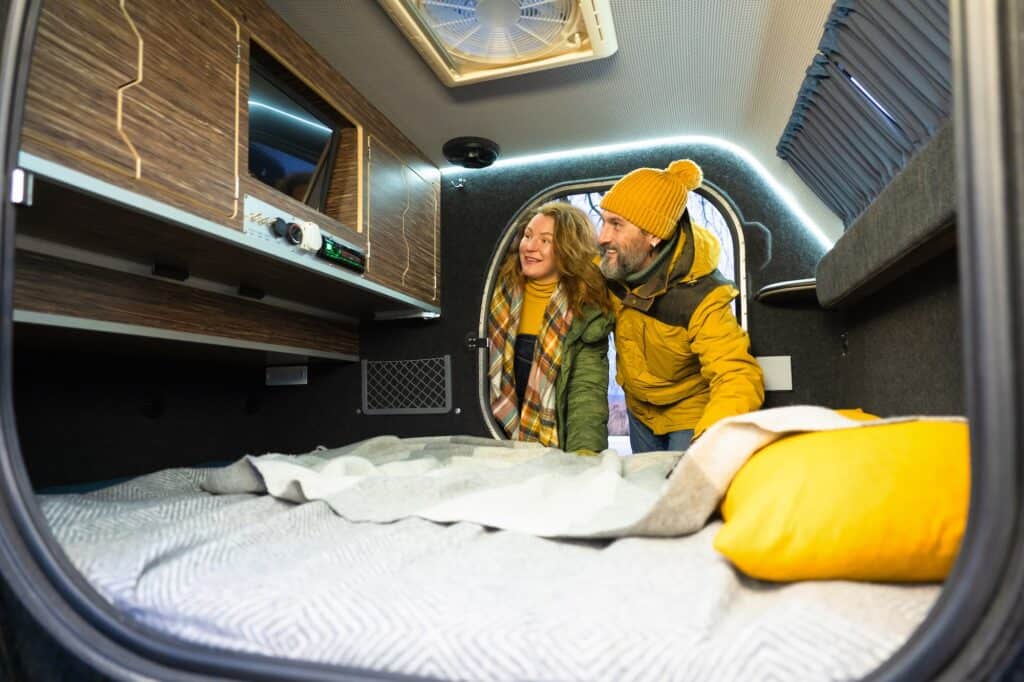 Couple in small camper considering RV Entertainment system upgrades