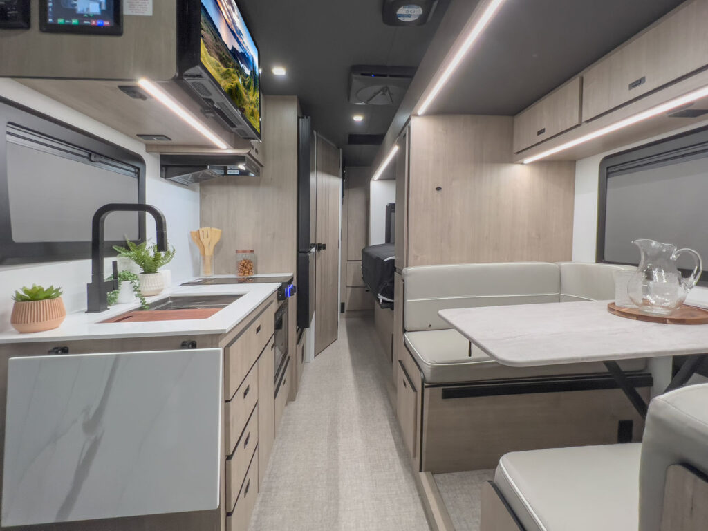 Grand Design RV Lineage - galley and dinette view.