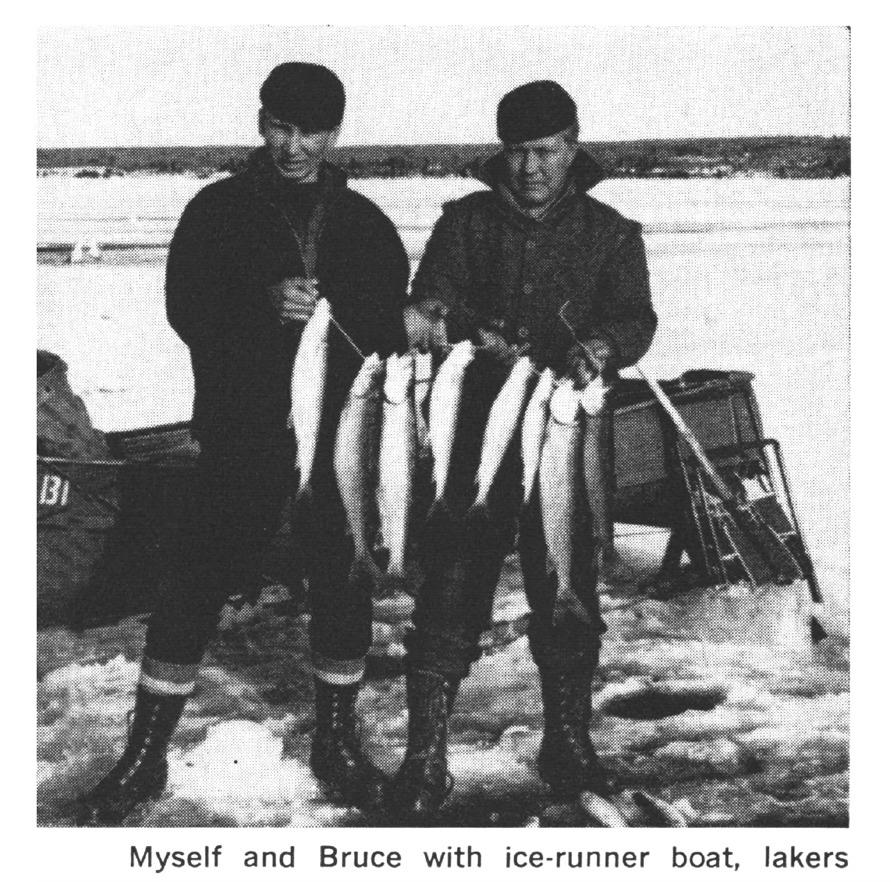 Two men with a stringer of fish stand on the ice.