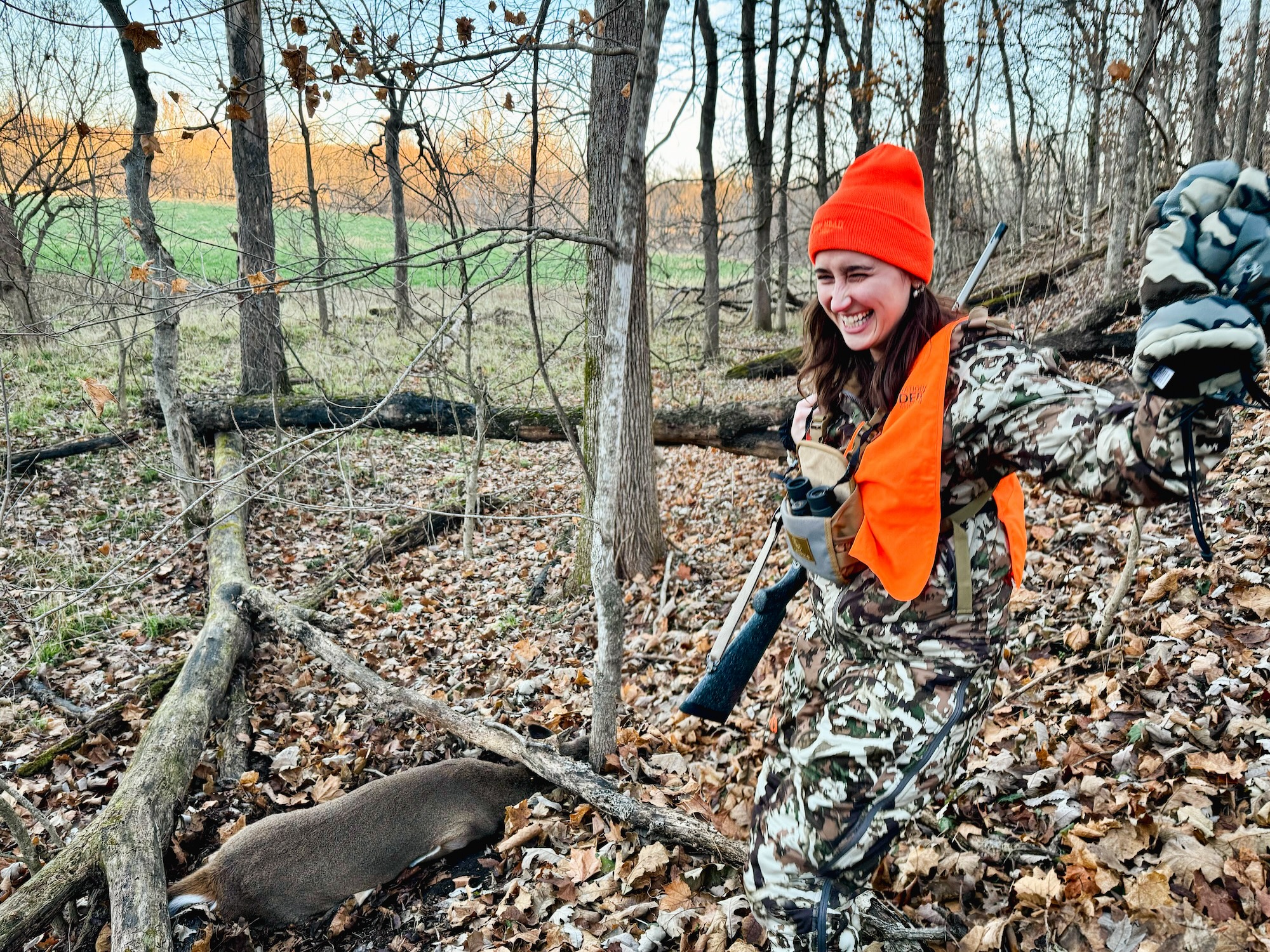 A a hunter celebrates her first deer.