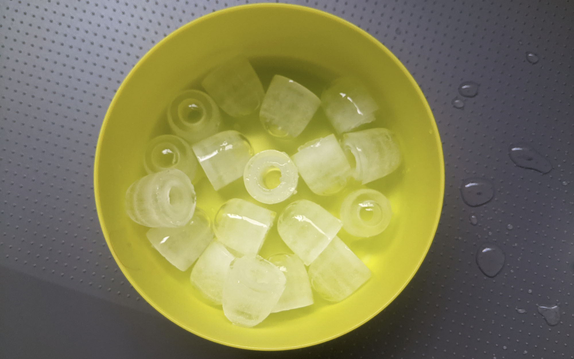 ice cubes in a yellow bowl