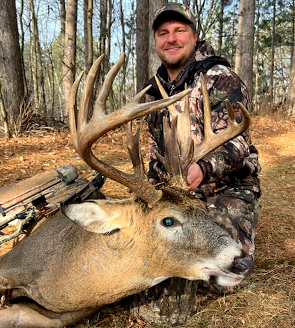 A bowhunter with a giant Wisconsin buck.