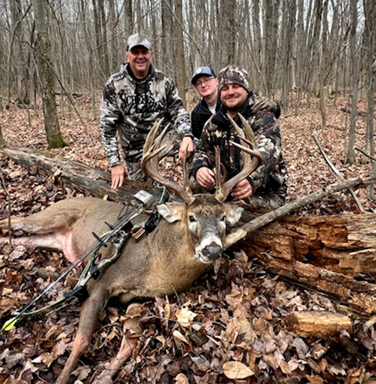 A successful bowhunter with his dad and brother.