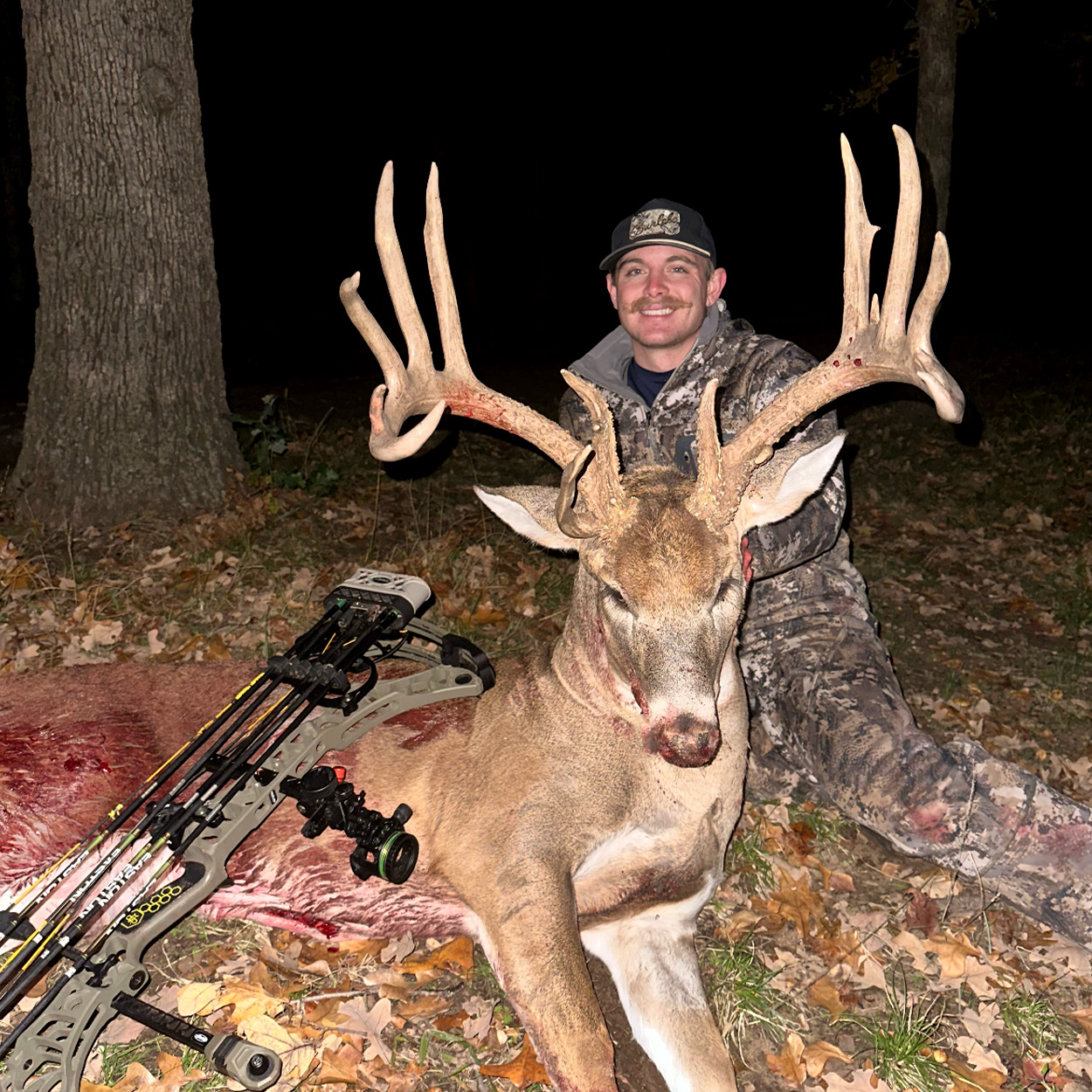 A bowhunter with a big Oklahoma buck.