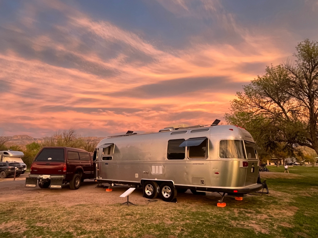 Truck and Airstream trailer in a campsite at Rio Grande Village Campground.