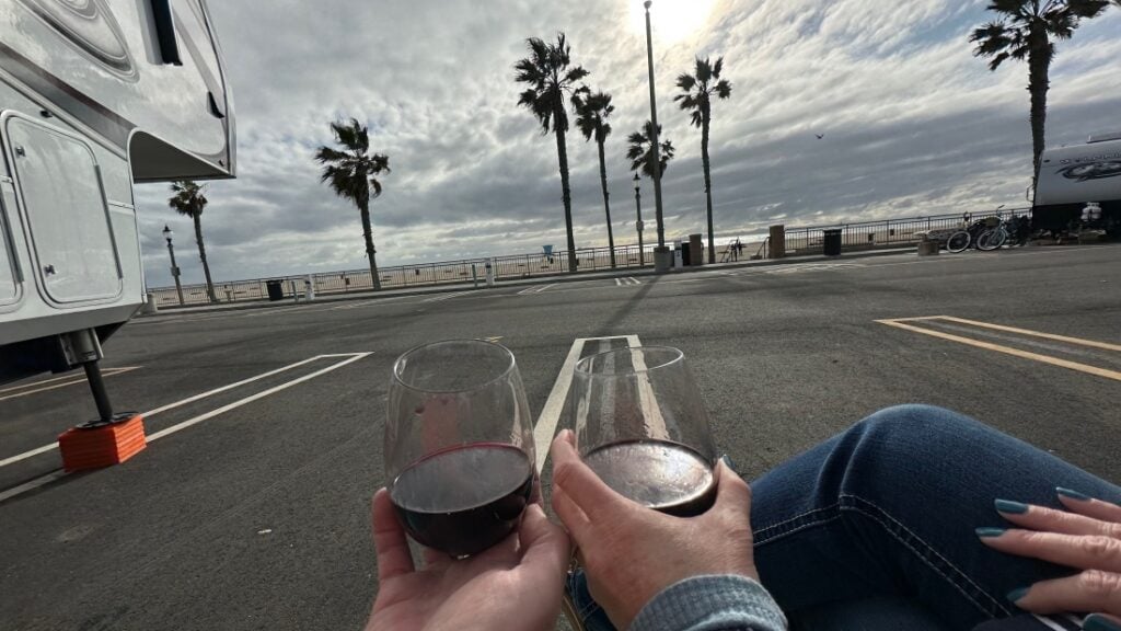 Couple toasting wine glasses at HBRV Campground.