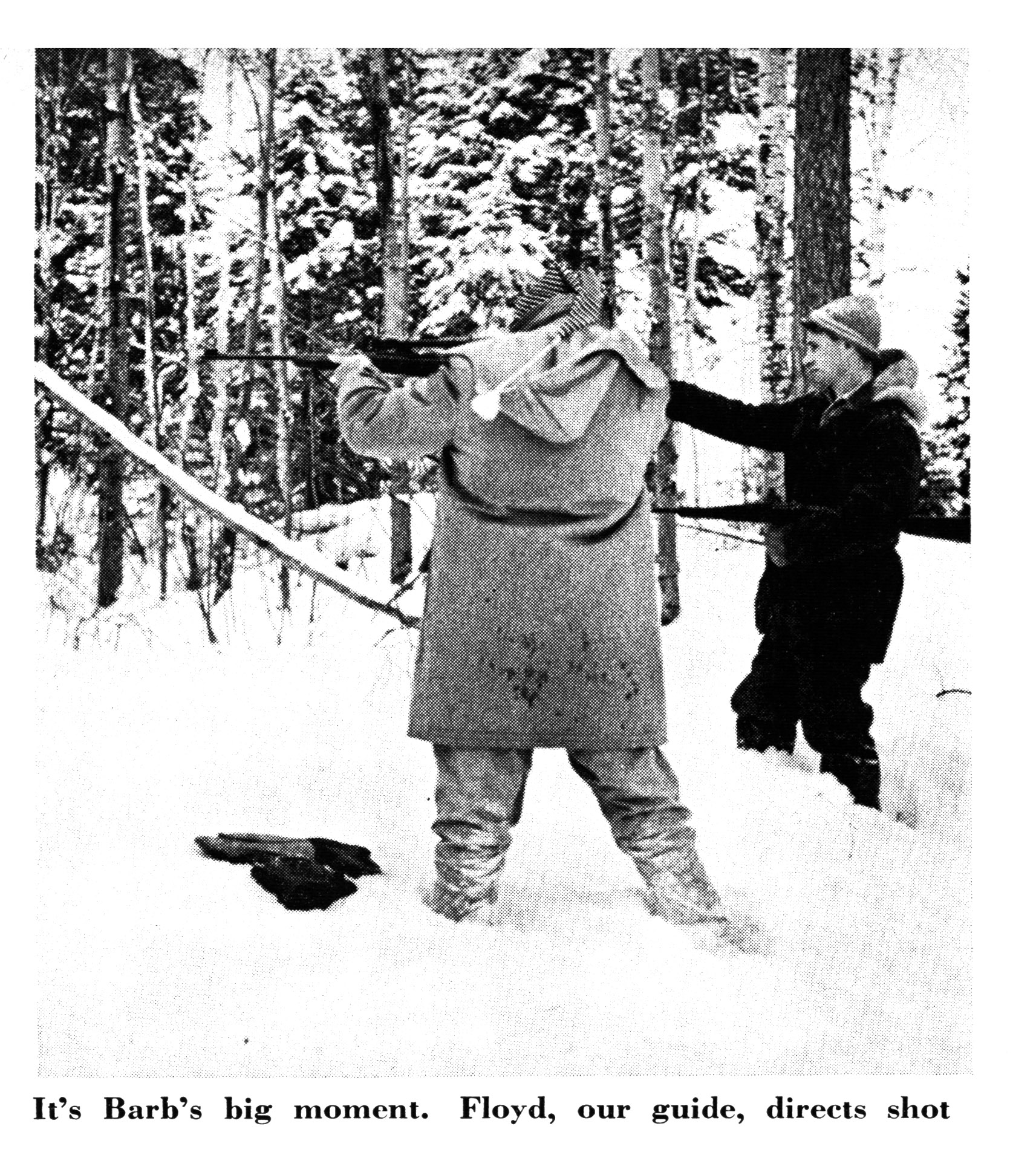 An old photo of a woman shooting offhand in the snow.