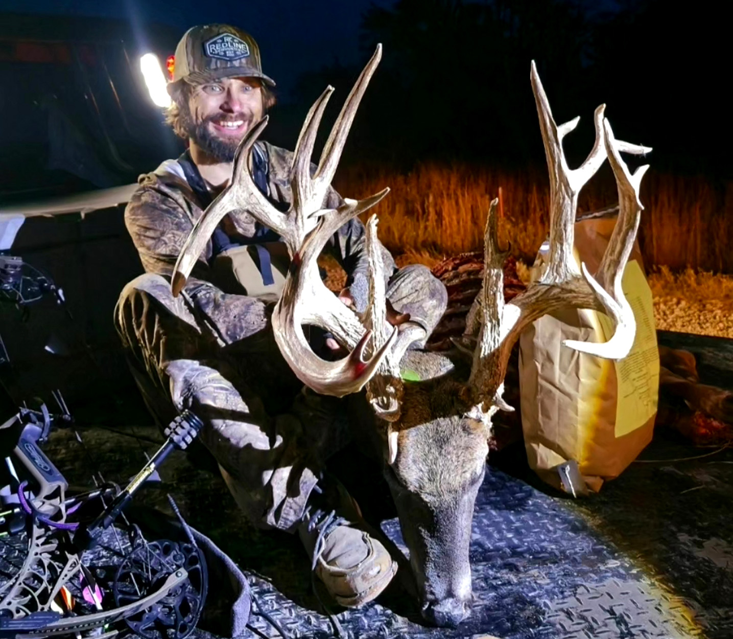 A Kansas bowhunter shows off a giant buck.