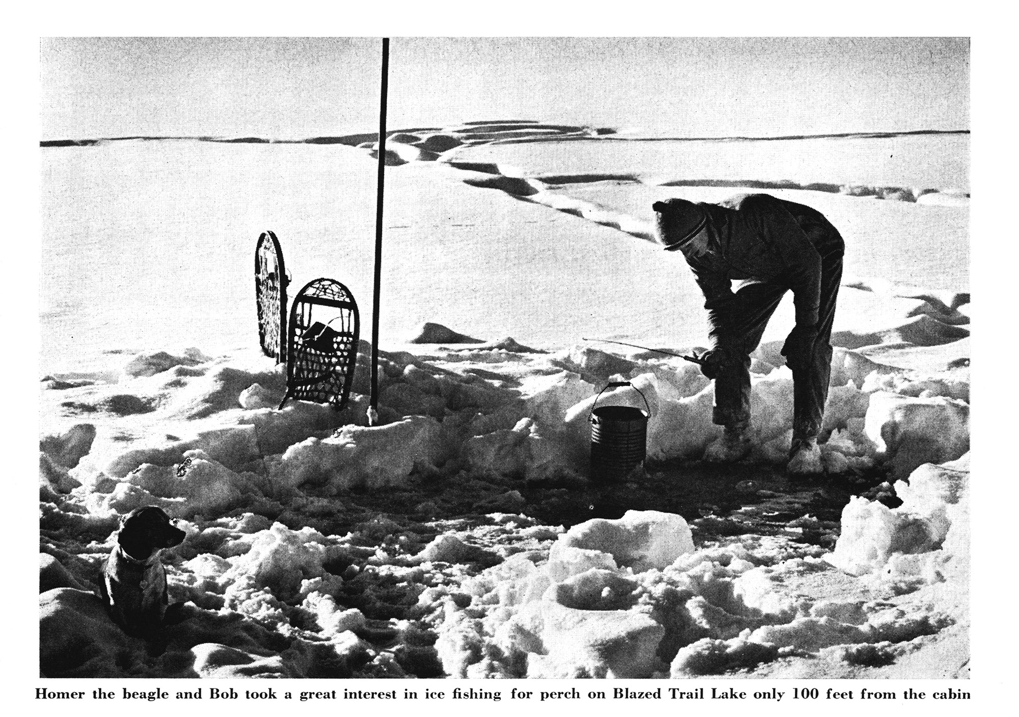 An old black and white photo of ice fishing.