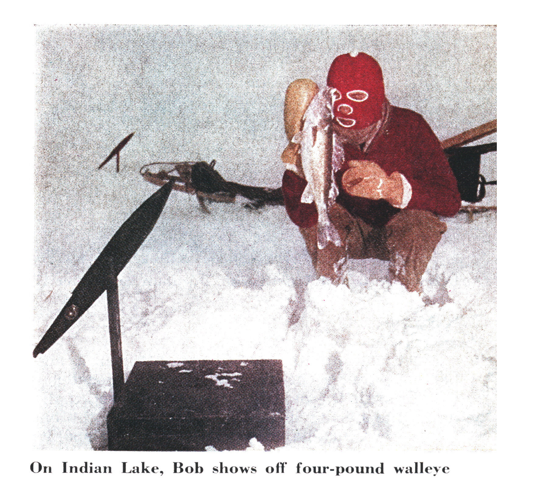 An old photo of a walleye ice fisherman.