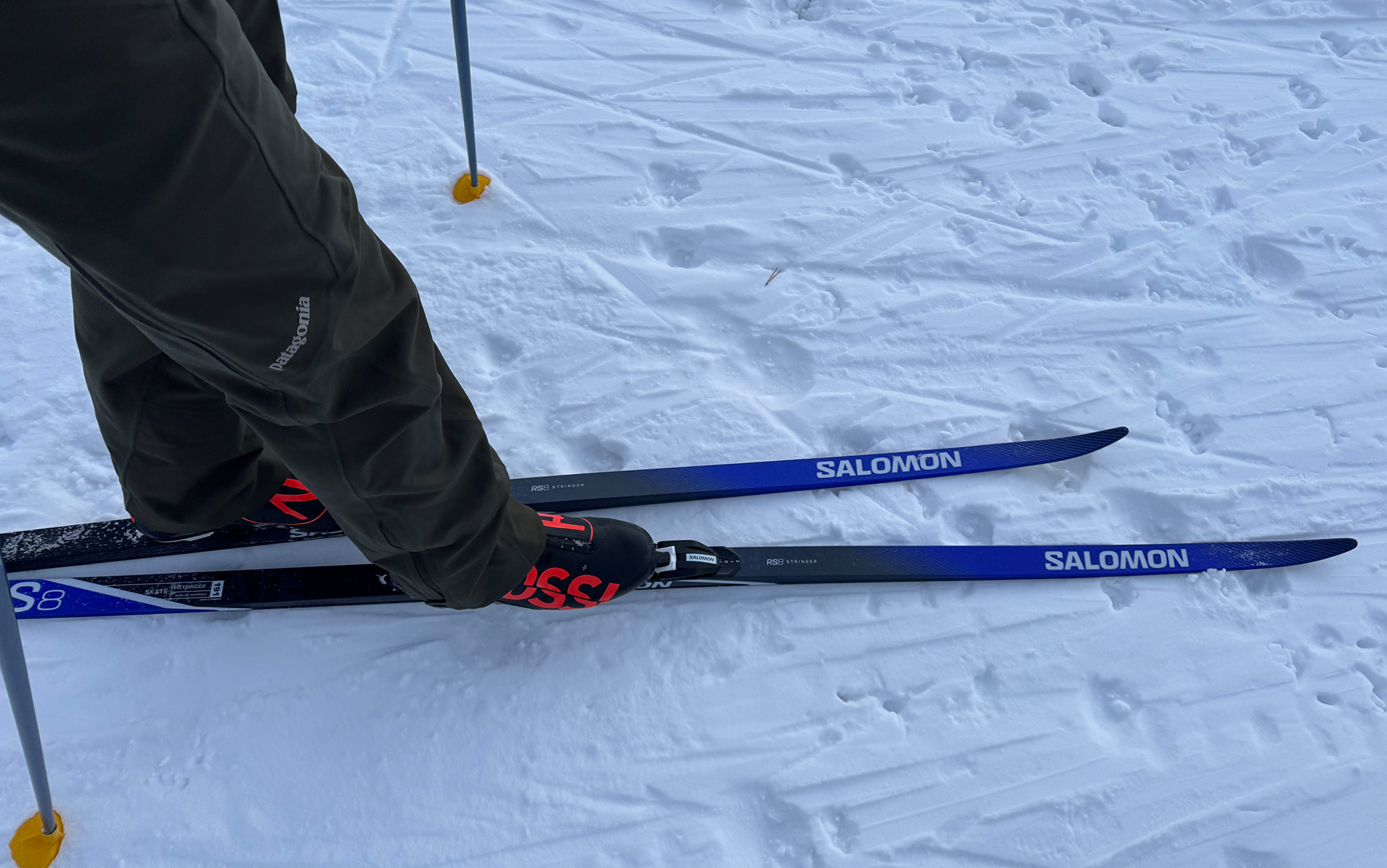 Skier wears Salomon skate skis.