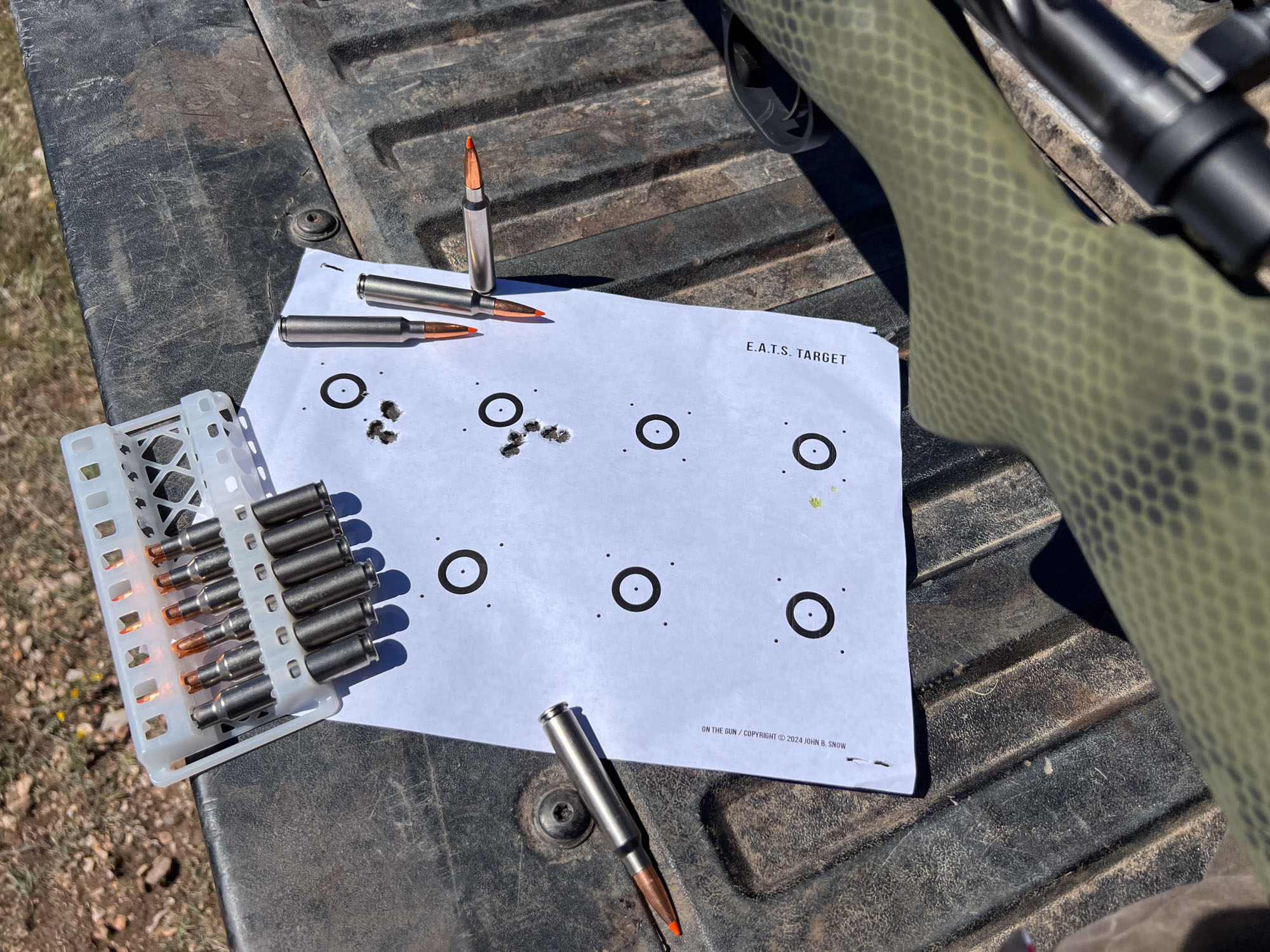 7mm Backcountry rounds and a target on a pickup truck tailgate