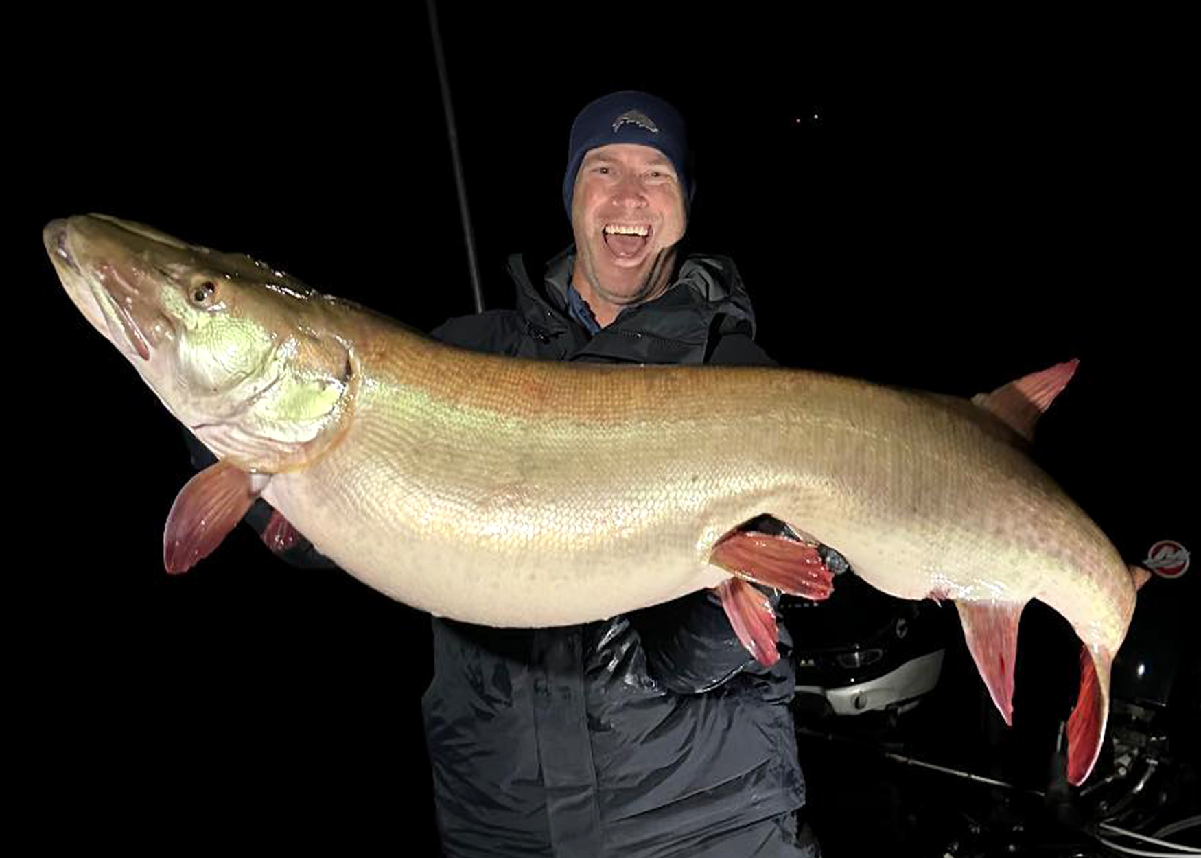 A fisherman with a world-record-sized muskie.