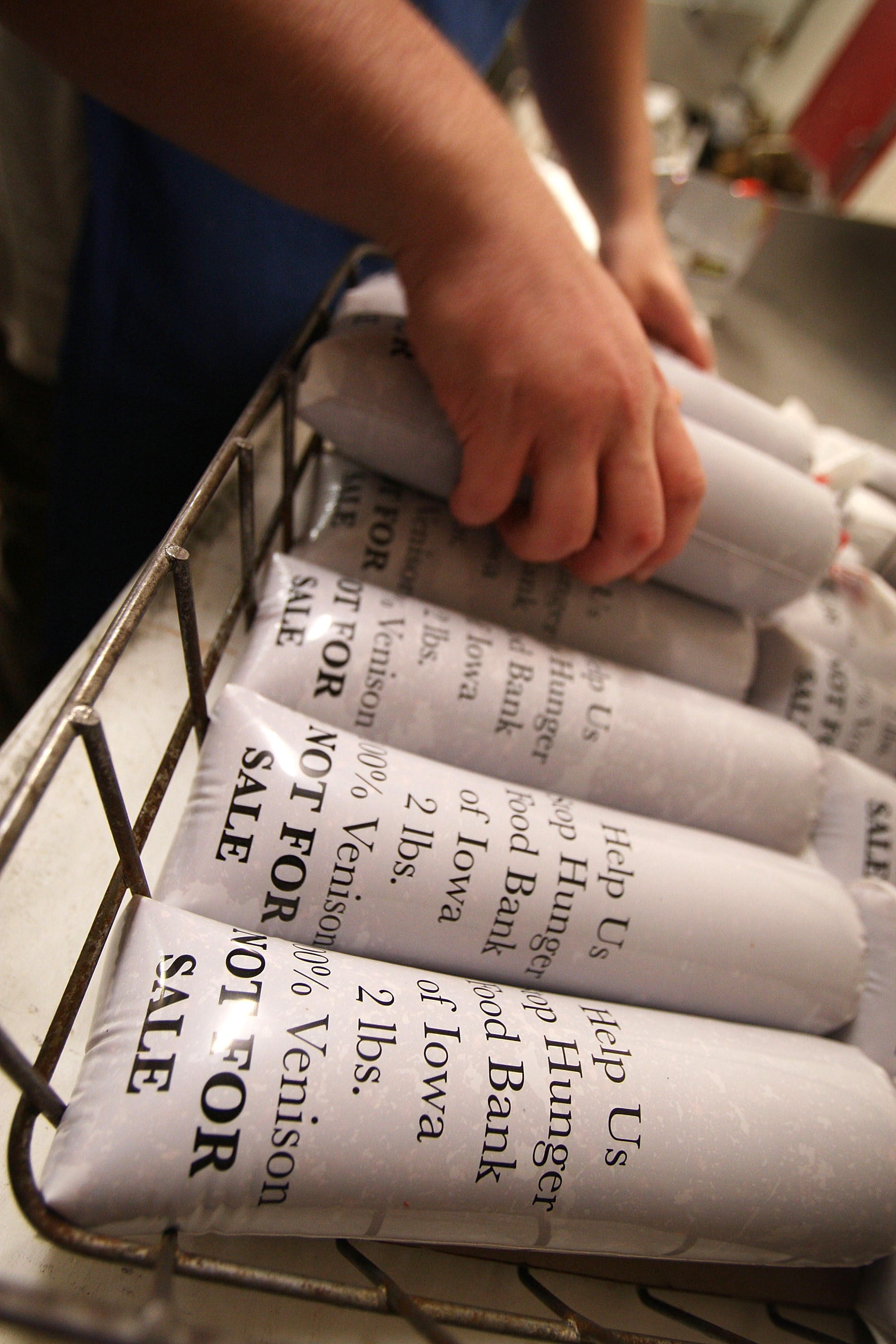 white packages of ground venison for donation