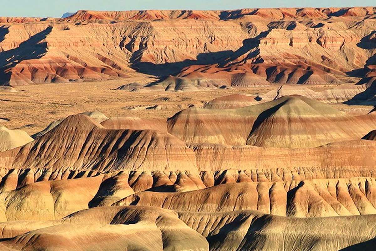 Rugged hills with multi-colored striations.