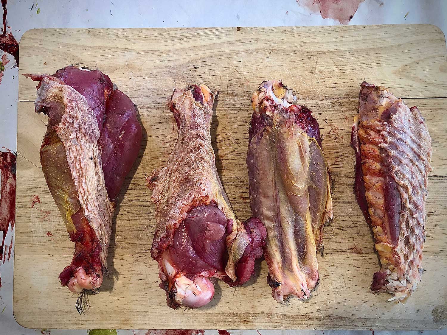 Wild turkey wings on a cutting board.