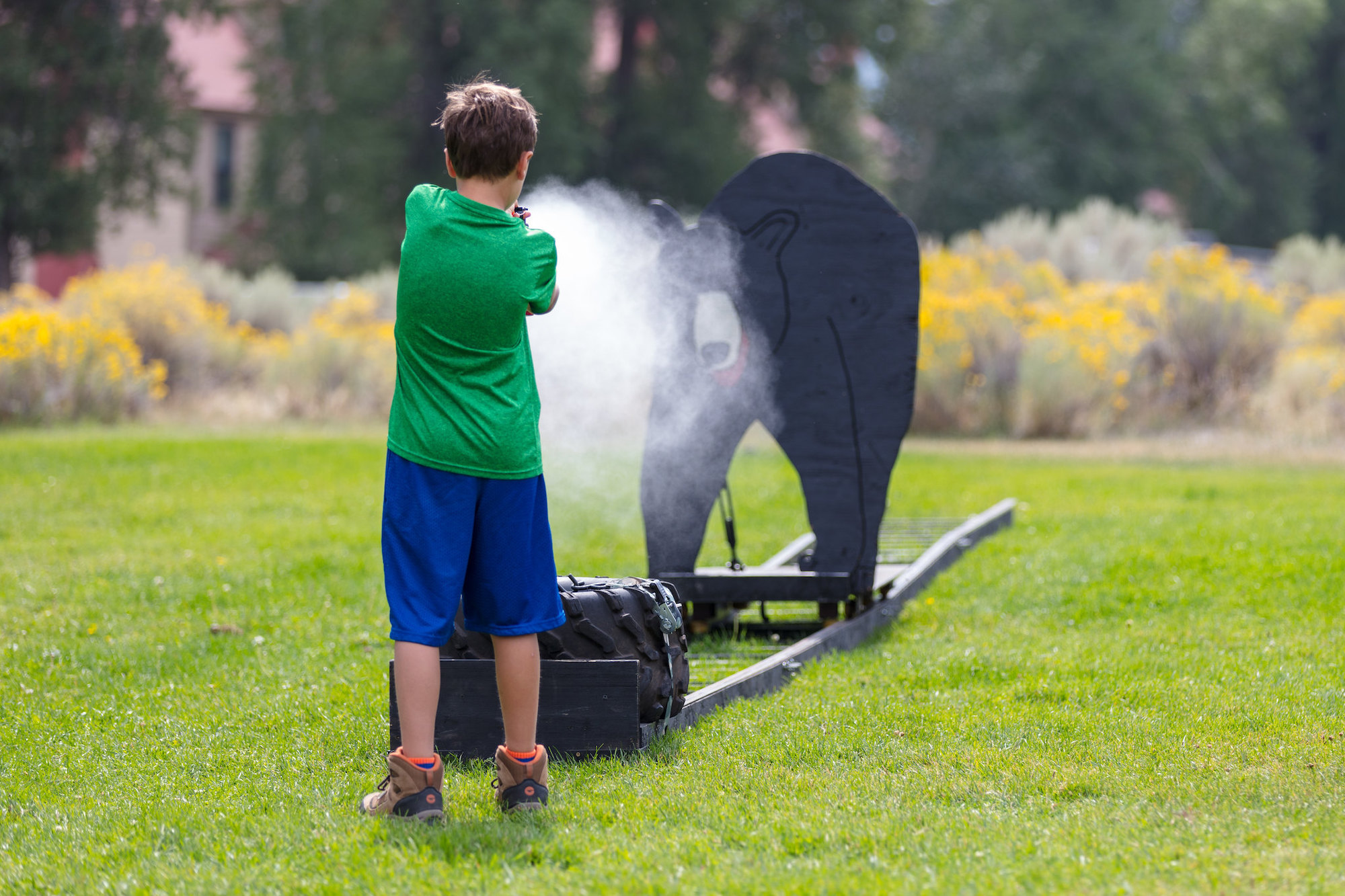 a kid practices with an inert canister