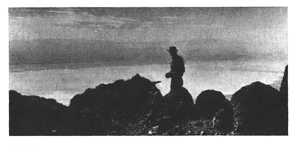 A silhouette of a sheep hunter on a peak in Oregon