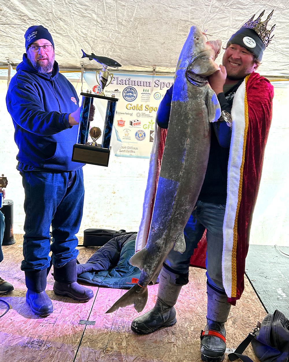 Two sturgeon anglers on stage during the 2025 special season on Black Lake.