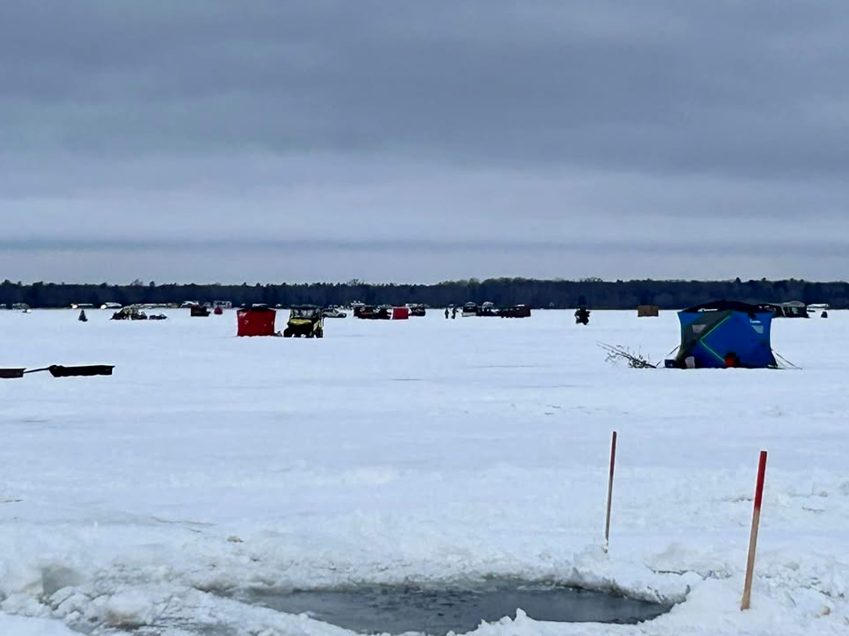 A hole in the ice on Black Lake during ice-fishing season.