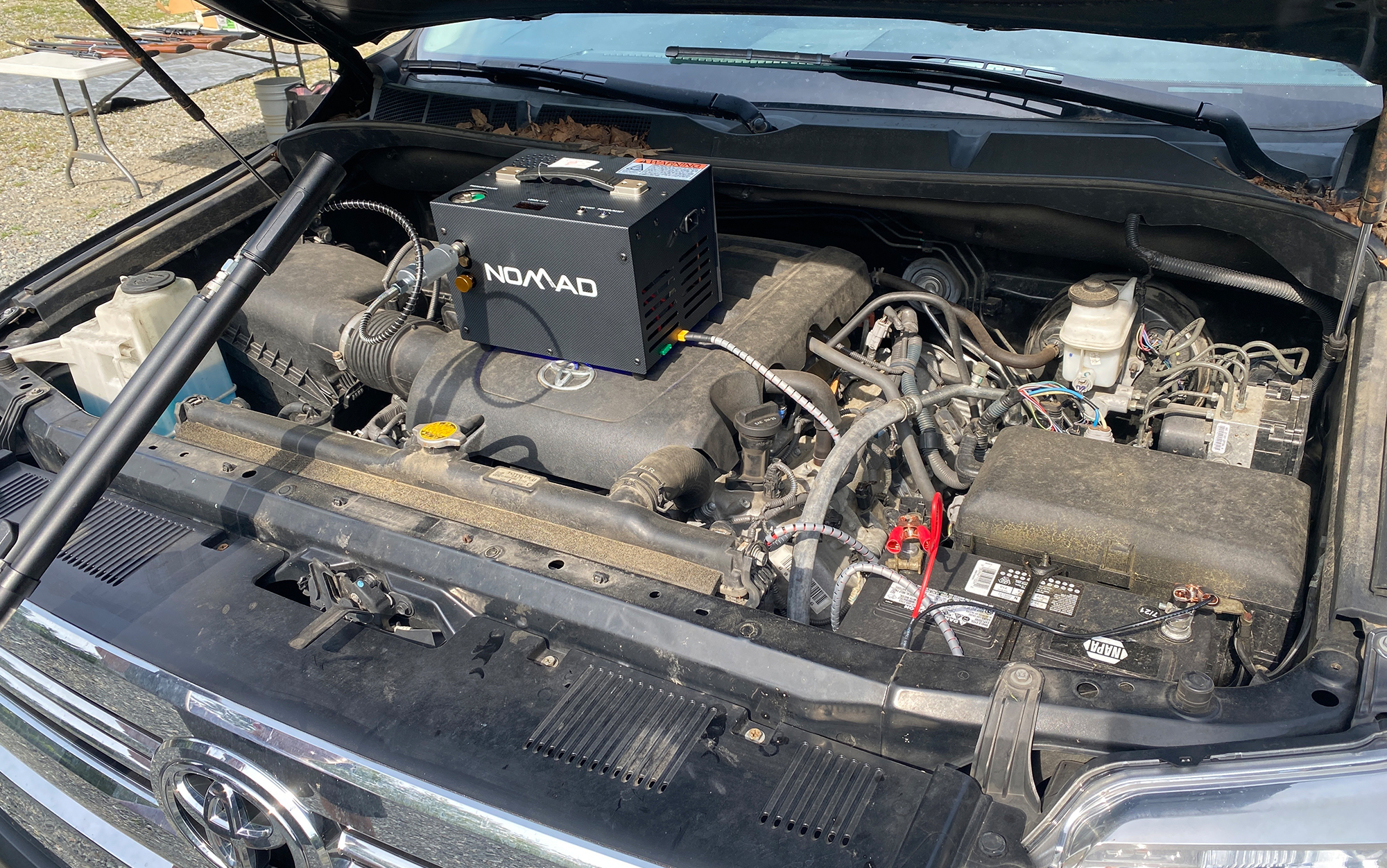 Filling up the Air Venturi Avenger with the Nomad attached to a car's battery.