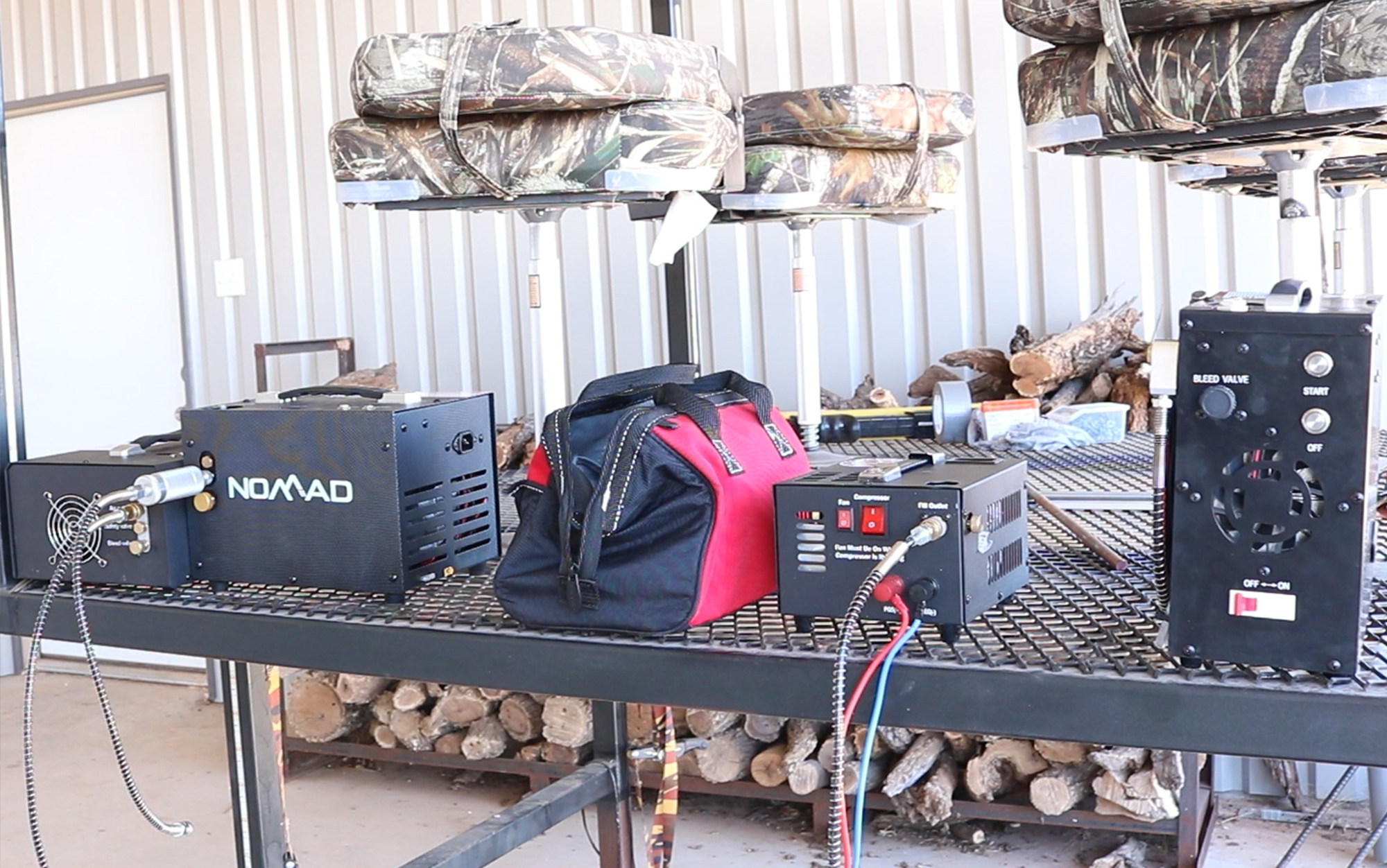 PCP air rifle compressors sit on a table.