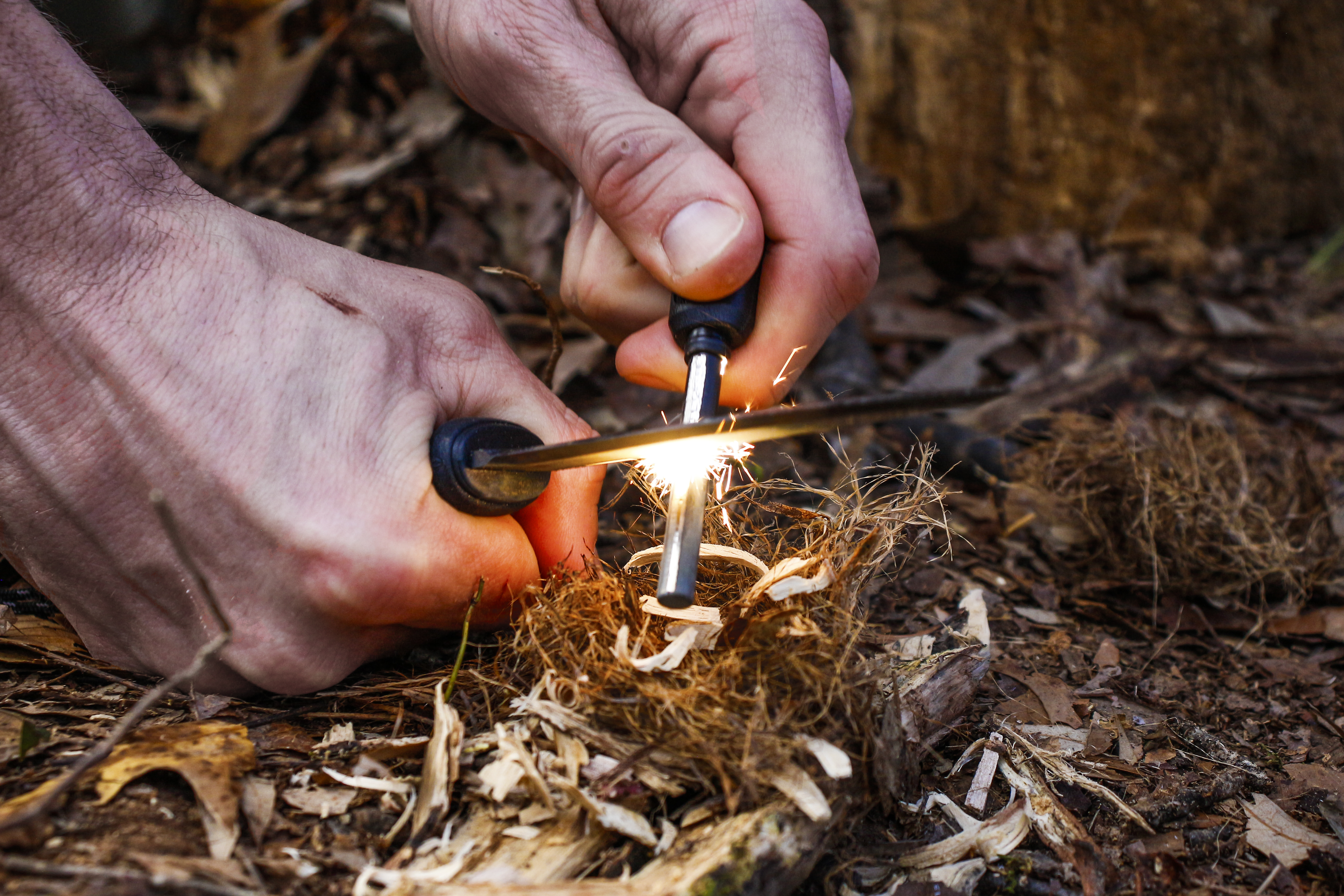 Striking a ferro rod with a survival knife