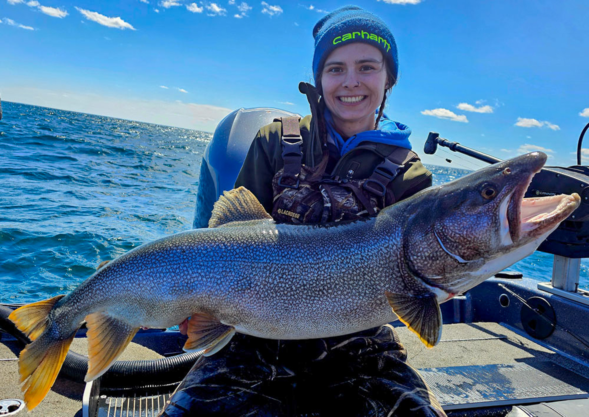 woman holds up record laker