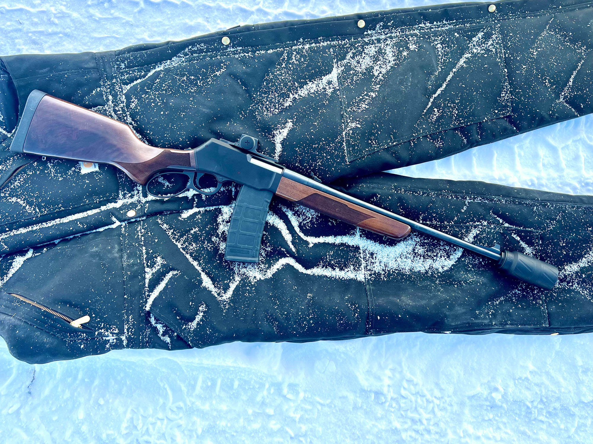 Henry Lever Action Supreme on snowy Carhartt bib