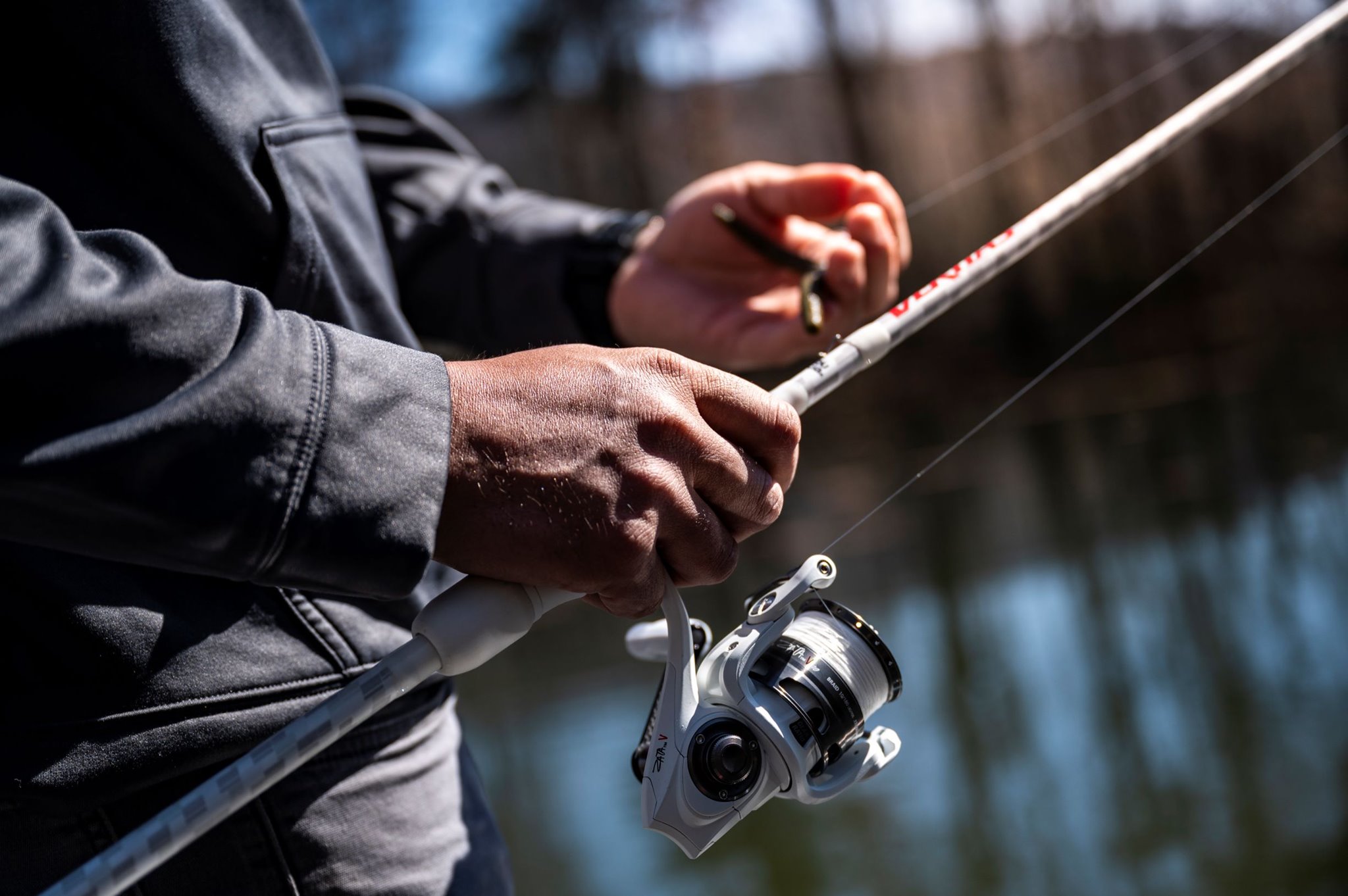 Prepping a spinning reel to cast.