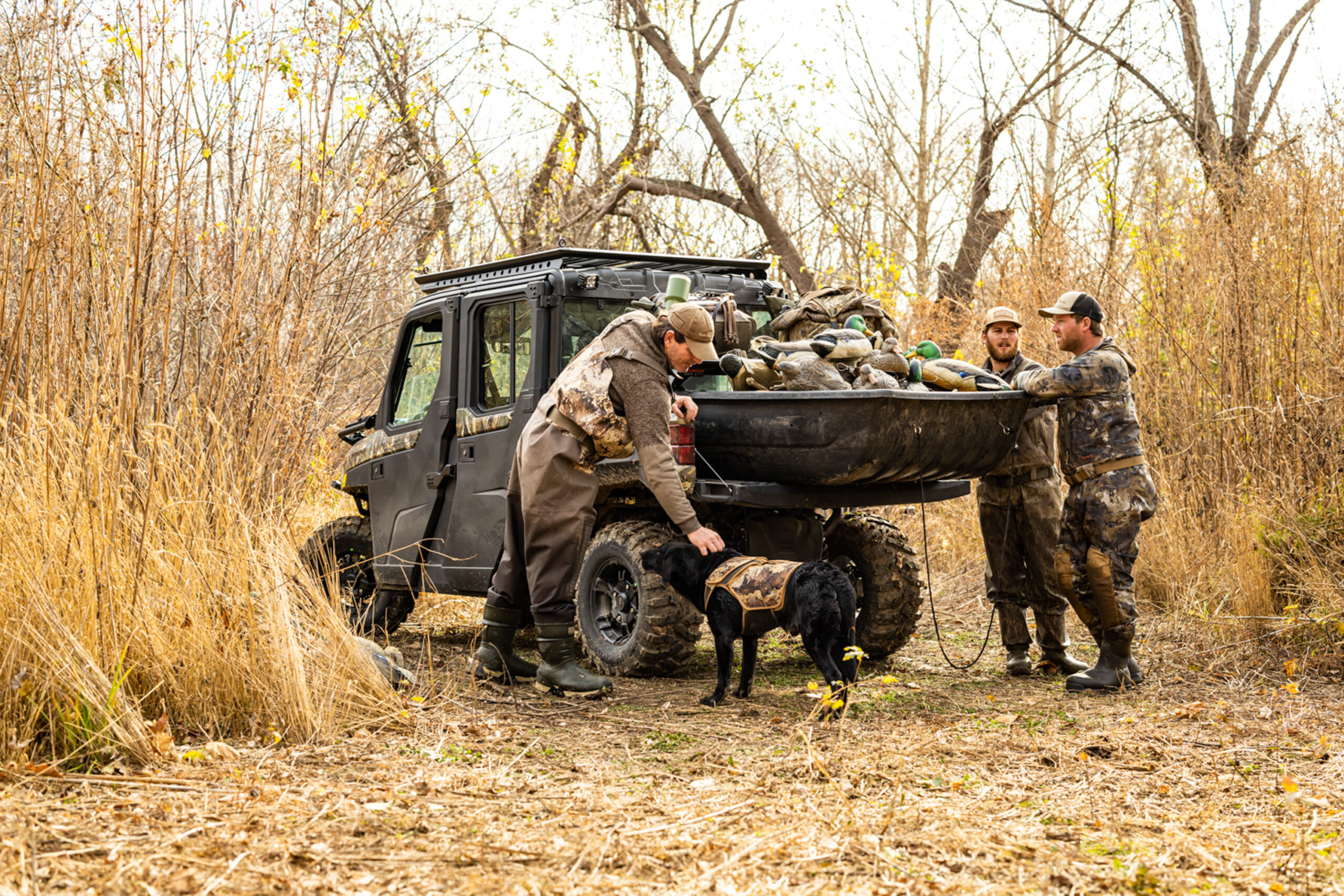 Tony Vandemore pets his dog after a morning duck hunt.