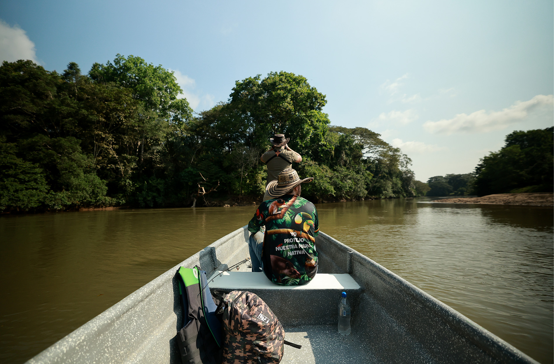 A biologist and a riverboat captain search for hippos in a Colombian river.