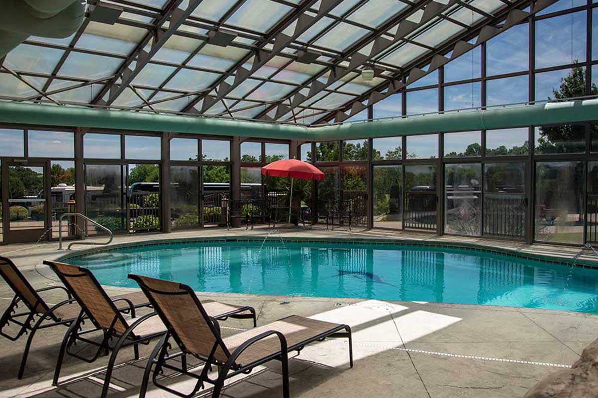 Indoor pool with glass walls.