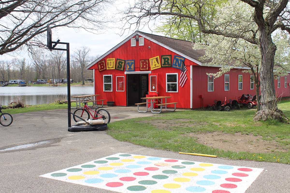 Red barn with "Busy Barn" above the door. 