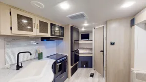 Prime Time Avenger’s 24BHSLE bunkhouse travel trailer has a bright, modern interior.